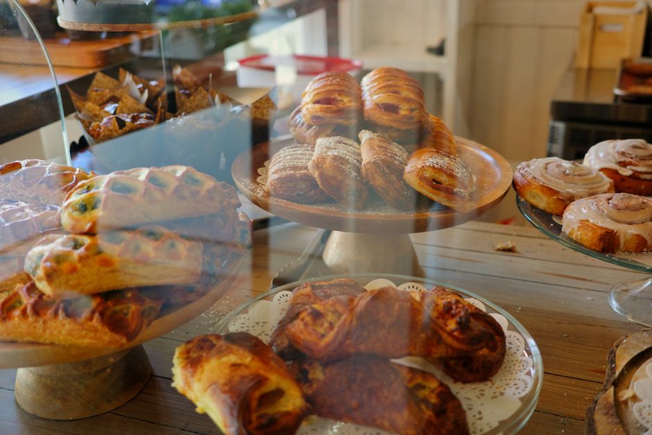 Pastry case with fresh baked goods for coffee shop upsell planning