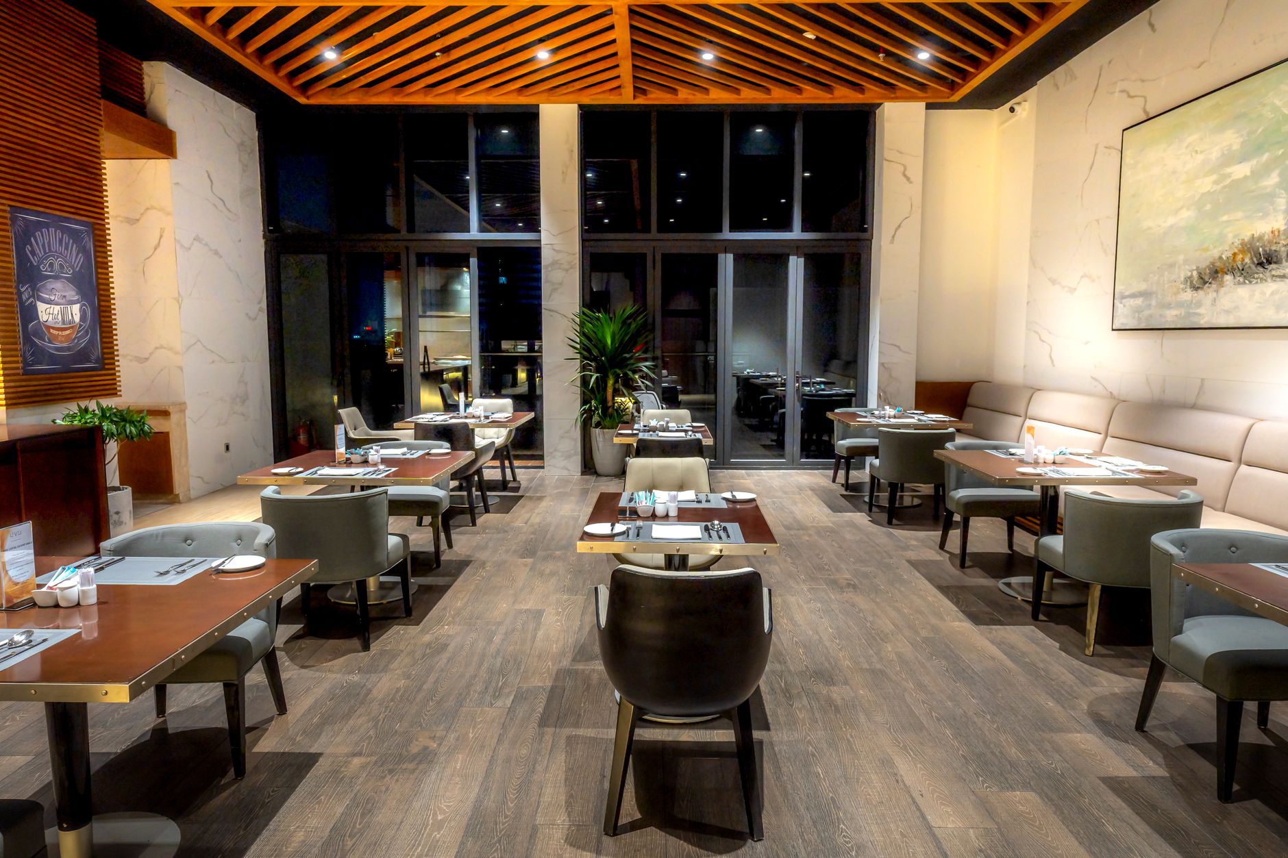 An elegant restaurant dining room prepared for service