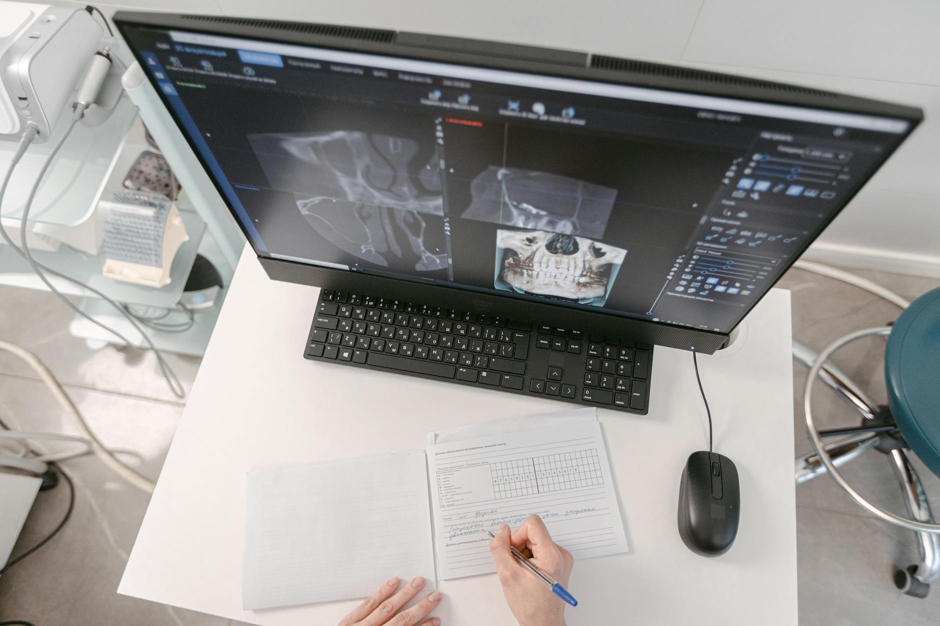 Doctor reviewing digital medical information on an office screen