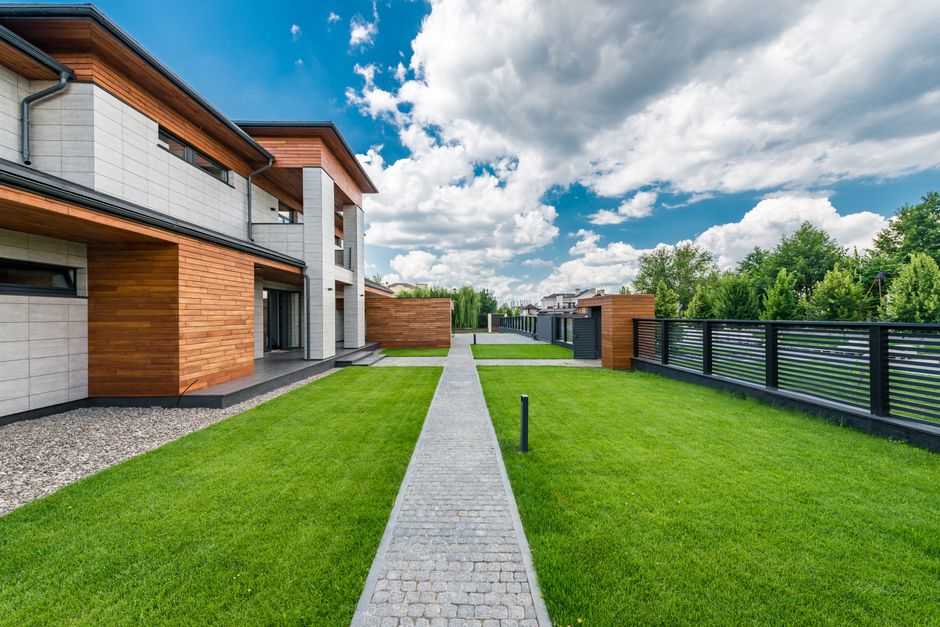 Contemporary house with a landscaped yard under a blue sky