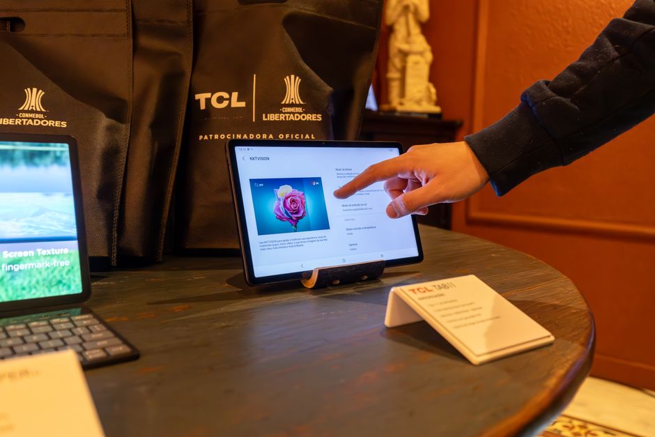 A tablet being used to review visual content before it is published to a larger display