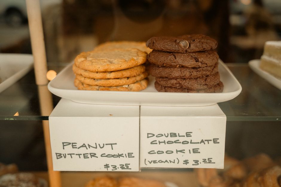 Bakery display with handwritten prices, showing why menu price updates matter in restaurant signage software