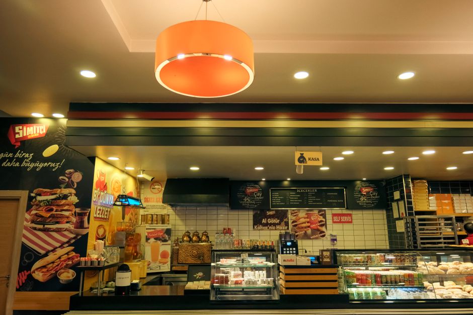 A bakery counter showing how several menu zones can stay readable above the service area
