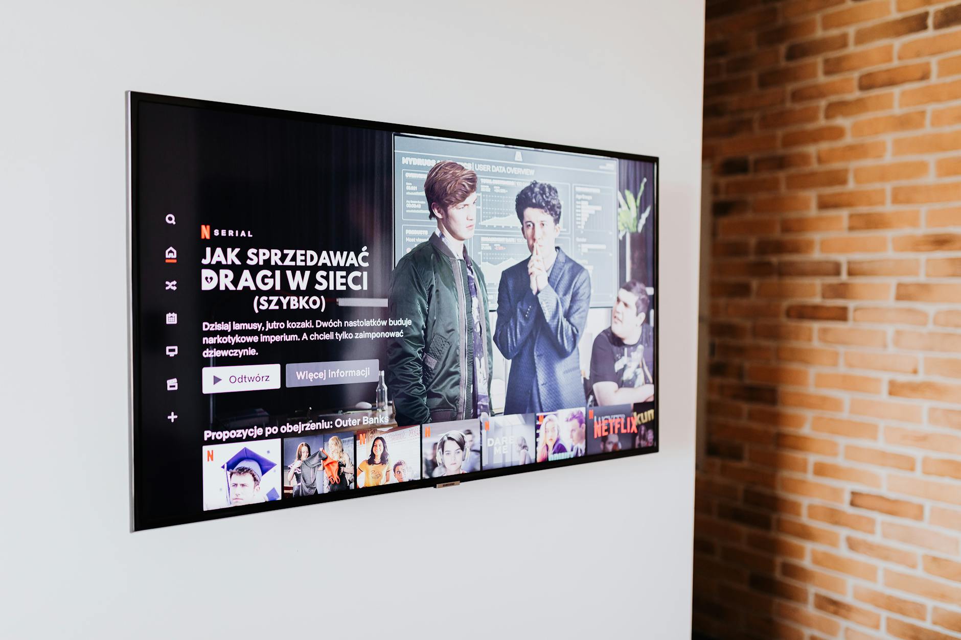 Digital signage display in a small venue showing promotional content