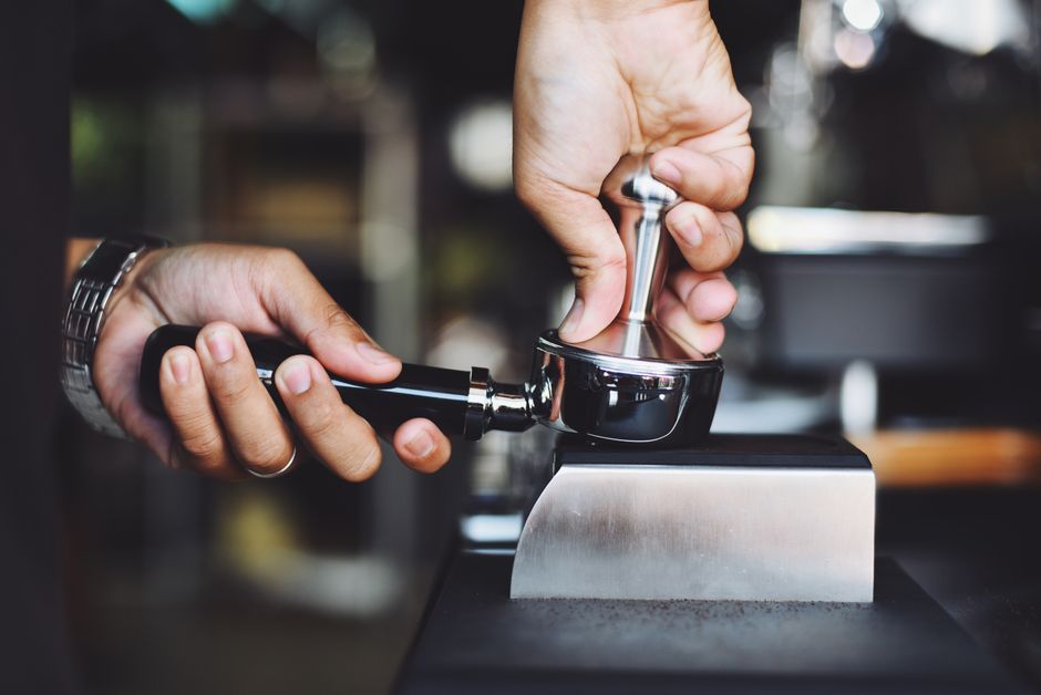Cafe barista preparing drinks, representing daily restaurant screen operations